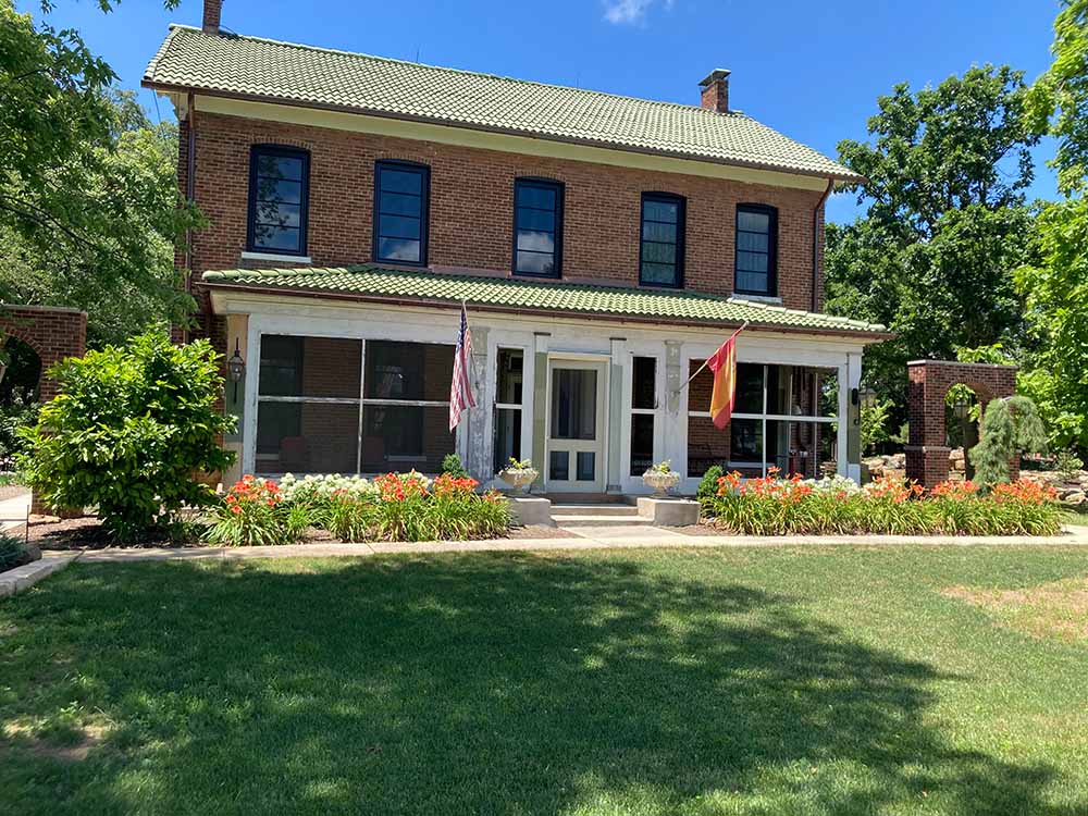 Image of a red brick historical home that will be getting a showcase garden